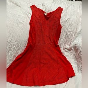 Brand is Crazy 8. A red dress with detailed flower patterns in the middle.